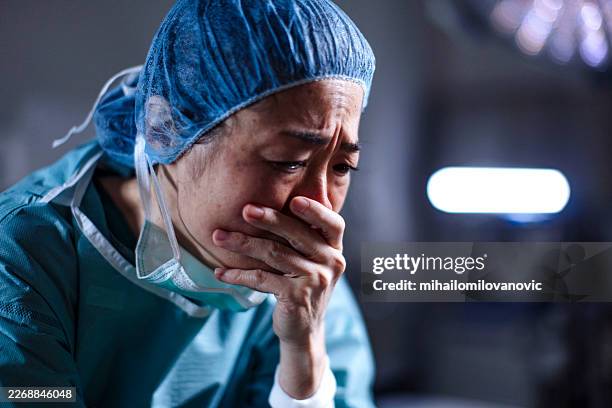 healer in pain - over burdened stock pictures, royalty-free photos & images