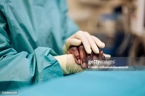 healing with kindness - surgical glove stock pictures, royalty-free photos & images
