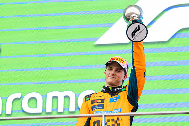 Oscar Piastri of Australia and McLaren Mastercard F1 Team raises his trophy in celebration on the podium during the F1 Grand Prix of Japan at Suzuka...