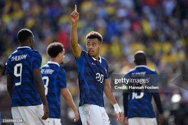 Desire Doue of France celebrates scoring his team's third goal during the international friendly match between Colombia and France at Northwest...