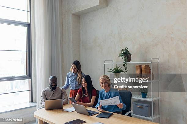 creative teamwork in bright office environment - growth mindset stock pictures, royalty-free photos & images