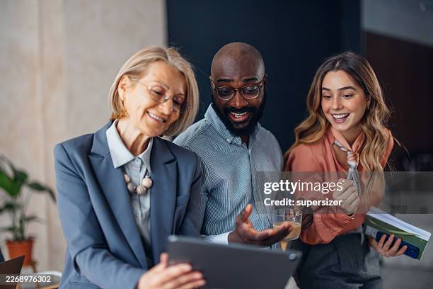 fun team interaction in creative workspace - emotional intelligence stock pictures, royalty-free photos & images