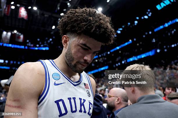Cameron Boozer of the Duke Blue Devils walks off the court after being defeated by the UConn Huskies 73-72 in the Elite Eight of the 2026 NCAA Men's...
