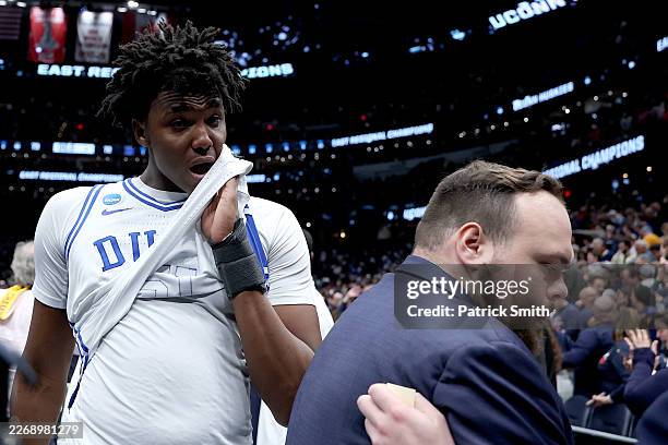 Patrick Ngongba of the Duke Blue Devils walks off the court after being defeated by the UConn Huskies 73-72 in the Elite Eight of the 2026 NCAA Men's...