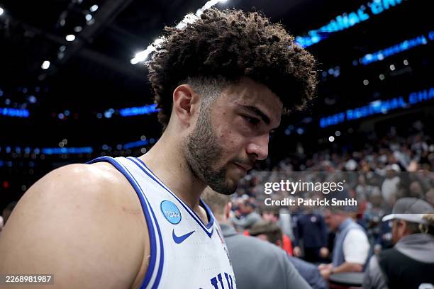 Cameron Boozer of the Duke Blue Devils walks off the court after being defeated by the UConn Huskies 73-72 in the Elite Eight of the 2026 NCAA Men's...
