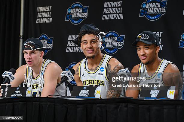 Will Tschetter, Yaxel Lendeborg, and Nimari Burnett of the Michigan Wolverines speak to media during the post game press conference after winning a...