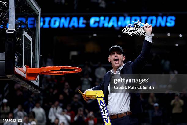 Head coach Dan Hurley of the UConn Huskies cuts down the net after defeating the Duke Blue Devils 73-72 in the Elite Eight of the 2026 NCAA Men's...