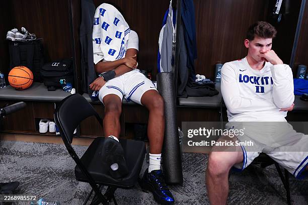 Patrick Ngongba of the Duke Blue Devils looks on in the locker room after being defeated the UConn Huskies 73-72 in the Elite Eight of the 2026 NCAA...