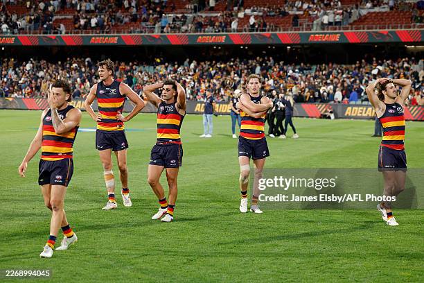 The Crows react after their loss during the 2026 AFL Round 04 match between the Adelaide Crows and the Fremantle Dockers at Adelaide Oval on April 3,...