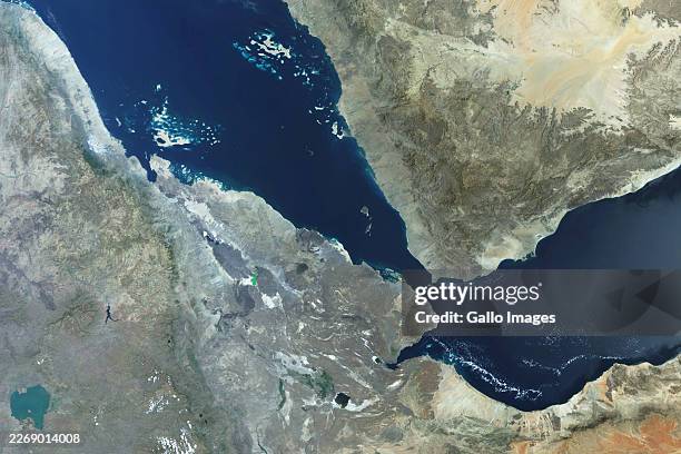 Satellite view of the Bab el-Mandeb Strait is a vital trade route linking the Red Sea, Gulf of Aden, Arabian Sea, Suez Canal, and Mediterranean. It...