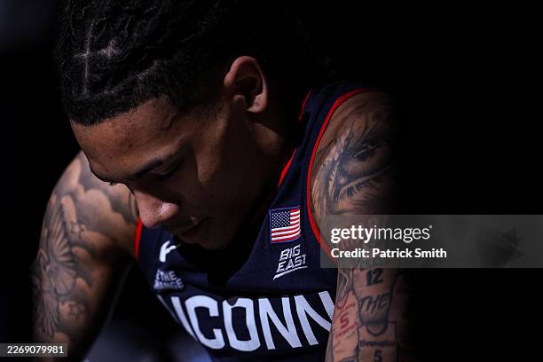 Solo Ball of the UConn Huskies waits to be introduced before playing against the Duke Blue Devils in the Elite Eight of the 2026 NCAA Men's...