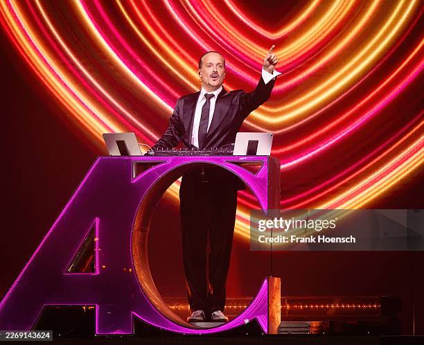 German composer and DJ Alex Christensen performs live on stage during a concert at the Tempodrom on March 28, 2026 in Berlin, Germany.