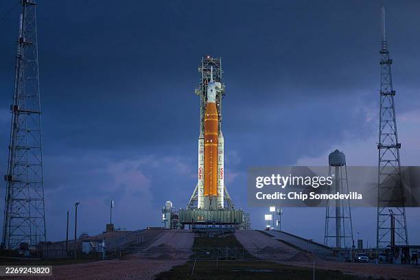 S 322-foot-tall Artemis II Space Launch System rocket and Orion spacecraft stand on Launch Complex 39B at Kennedy Space Center on March 31, 2026 in...