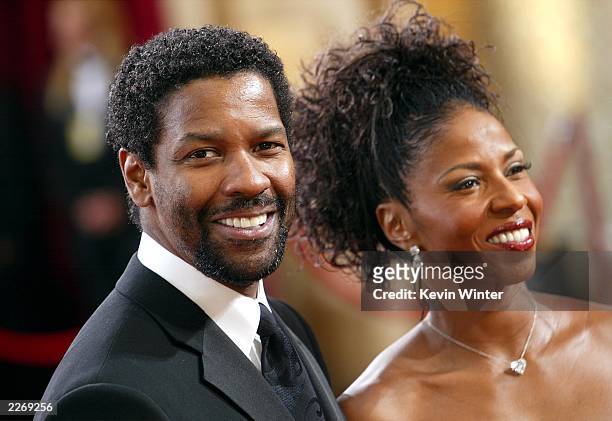 Actor Denzel Washington and wife Pauletta attend the 75th Annual Academy Awards at the Kodak Theater on March 23, 2003 in Hollywood, California.