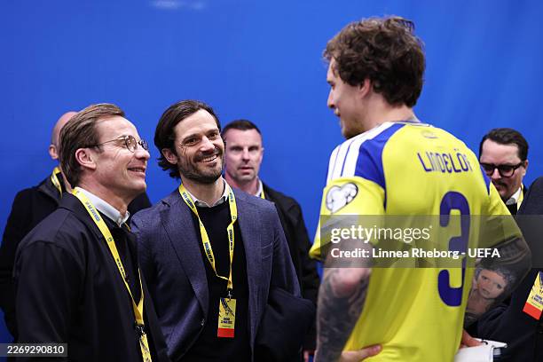 Ulf Kristersson, Prime Minister of Sweden, and Prince Carl Philip of Sweden interact with Victor Lindeloef of Sweden following the FIFA World Cup...