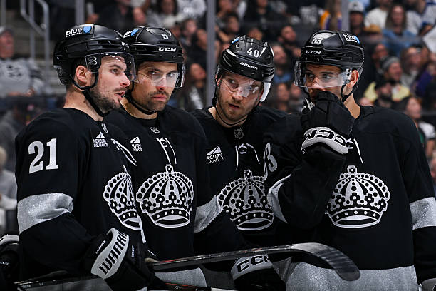 Los Angeles Kings meet on the ice during the second period against the Toronto Maple Leafs at Crypto.com Arena on April 4, 2026 in Los Angeles,...
