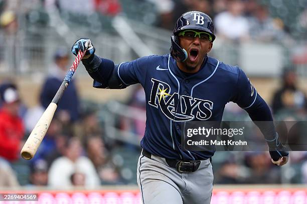 Richie Palacios of the Tampa Bay Rays celebrates a go-ahead two-run home run against the Minnesota Twins during the tenth inning at Target Field on...
