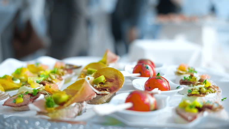 https://media.gettyimages.com/id/2269479202/video/appetizers-arranged-on-buffet-table-at-business-conference.jpg?b=1&s=640x640&k=20&c=XCKhUm9JIuSOrSmmSNHncbyv8olqFTyFsFWzs2GM4hE=