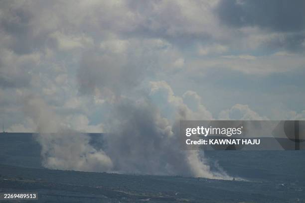 Photograph taken from the southern Lebanese city of Tyre shows smoke induced by Israeli military activities as it rises from the area of Naqoura on...