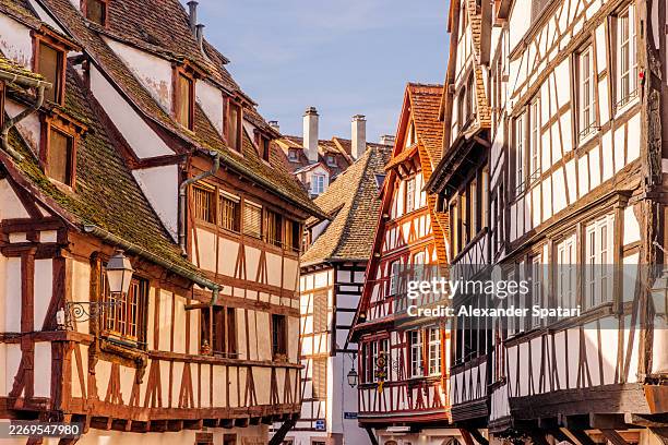 half-timbered houses in petite france historic district - a part of unesco world heritage - on a sunny day, strasbourg, france - alsace stock pictures, royalty-free photos & images