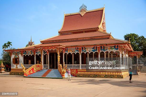 ornate buddhist temple building of wat that luang tai, vientiane, laos - vientiane stock pictures, royalty-free photos & images
