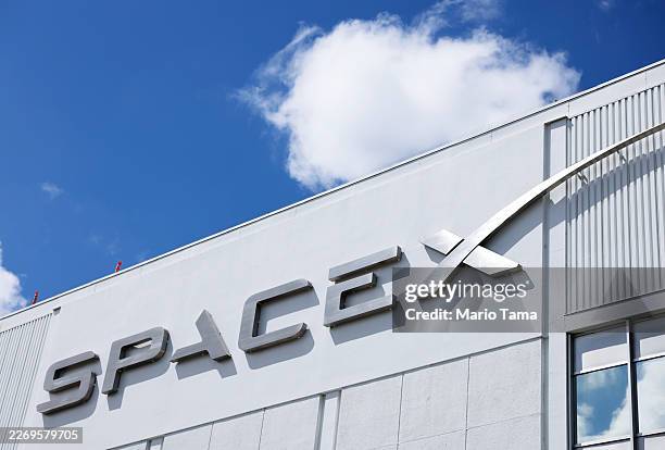 The SpaceX logo is displayed at a SpaceX facility on April 2, 2026 in Hawthorne, California. Elon Musk’s rocket and satellite company SpaceX has...