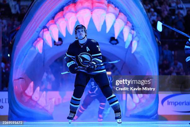Macklin Celebrini of the San Jose Sharks takes the ice through the Shark Head before the game against the Chicago Blackhawks at SAP Center on April...