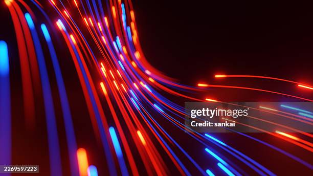 abstract fiber optic light trails in red and blue representing high-speed digital data and network connection - bandwidth stock pictures, royalty-free photos & images