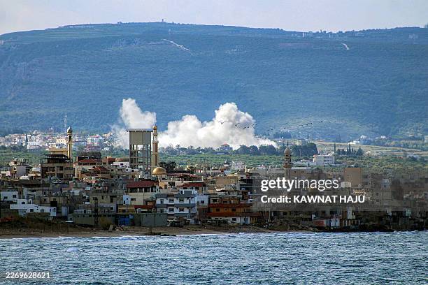 Smoke rises following Israeli bombardment on the village of Qlaile as pictured from nearby Tyre in southern Lebanon on April 7, 2026. The Israeli...