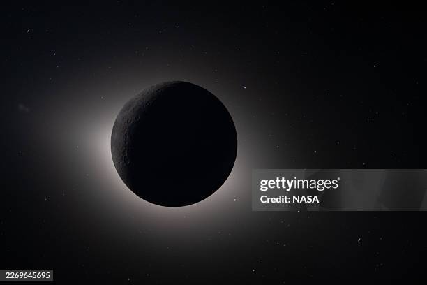 In this handout image provided by NASA, Captured by the Artemis II crew during their lunar flyby on April 6 this image shows the Moon fully eclipsing...