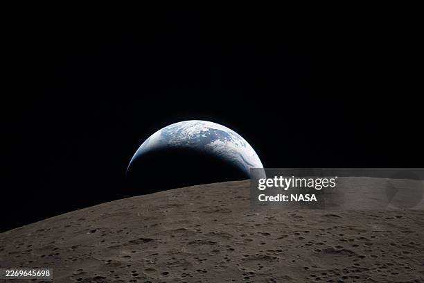 In this handout image provided by NASA, Earthset captured through the Orion spacecraft window at 6:41 p.m. EDT, April 6 during the Artemis II crew’s...