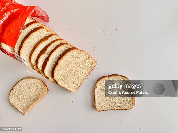 sliced sandwich bread on neutral background - white bread stock pictures, royalty-free photos & images