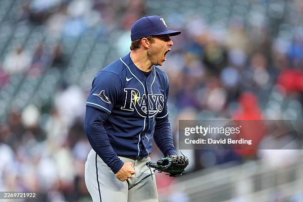 Hunter Bigge of the Tampa Bay Rays celebrates a strikeout against Kody Clemens of the Minnesota Twins in the sixth inning during the home opener at...