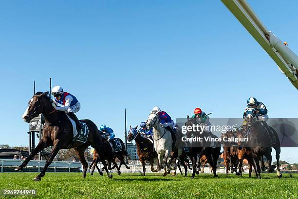 Logan Bates riding Ambassadorial winning Race 8, the Tobin Brothers Easter Cup during Melbourne Racing at Caulfield Racecourse on April 04, 2026 in...