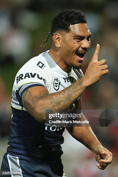 Tom Mikaele of the Cowboys celebrates scoring a try during the round five NRL match between St George Illawarra Dragons and North Queensland Cowboys...