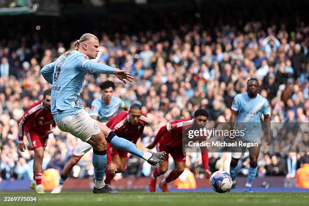 Erling Haaland of Manchester City scores his team's first goal from the penalty spot during the Emirates FA Cup Quarter Final match between...