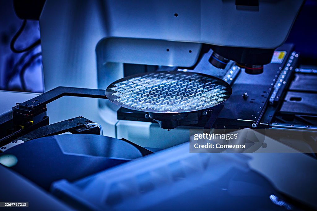 Computer Wafer on Robotic Arm at Production Line