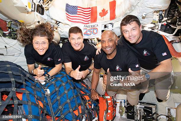 In this handout image provided by NASA, The Artemis II crew – Mission Specialist Christina Koch, Mission Specialist Jeremy Hansen, Pilot Victor...