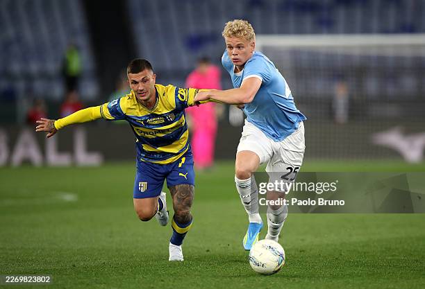 Gabriel Strefezza of Parma Calcio 1913 and Oliver Provstgaard of Lazio battle for possession during the Serie A match between SS Lazio and Parma...