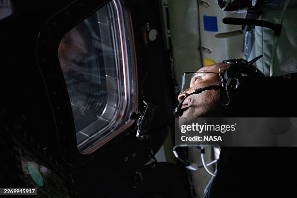 In this handout image provided by NASA, NASA astronaut and Artemis II Pilot Victor Glover pictured here in the Orion spacecraft during the Artemis II...
