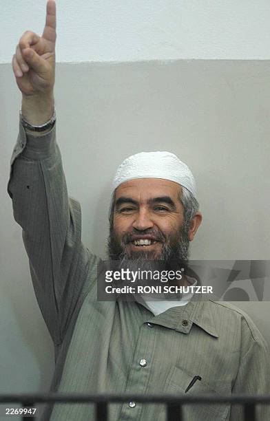 Sheikh Raed Salah, the head of the Islamic Movement in Israel, shows his trust in God as he appears 24 June 2003 in a Haifa court to face charges,...