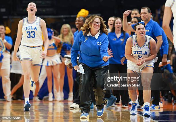 Amanda Muse, head coach Cori Close, and Charlisse Leger-Walker of the UCLA Bruins react during the second quarter against the South Carolina...