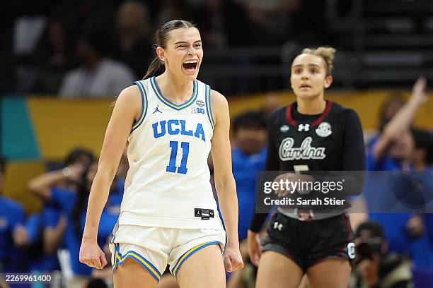 Gabriela Jaquez of the UCLA Bruins reacts in front of Tessa Johnson of the South Carolina Gamecocks during the third quarter in the National...