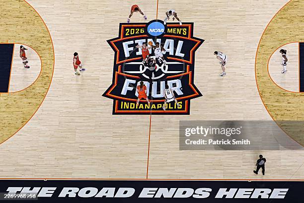 Tarris Reed Jr. #5 of the UConn Huskies jumps for the ball against Tomislav Ivisic of the Illinois Fighting Illini in the Final Four of the 2026 NCAA...