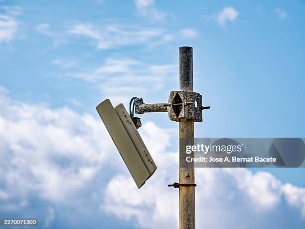 pole with a security and surveillance camera broken after a robbery. - broken record stock pictures, royalty-free photos & images