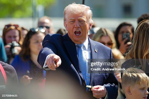 President Donald Trump watche children roll Easter eggs during the White House Easter Egg Roll on the South Lawn of the White House on April 06, 2026...