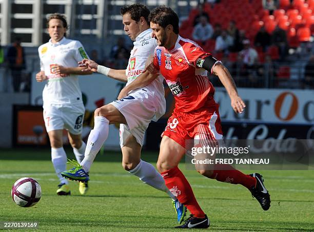 Brest's french midfielder Benoit Lesoimier vies with Ajaccio's french defender Jean-Baptiste Pierazzi during the French L1 football match Brest vs...