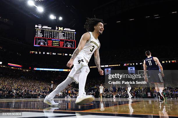 Elliot Cadeau of the Michigan Wolverines celebrates after defeating the UConn Huskies 69-63 in the National Championship of the 2026 NCAA Men's...