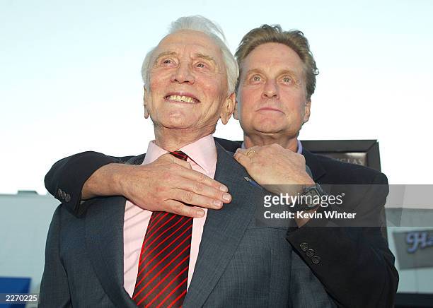 Actor Kirk Douglas and son producer/actor Michael Douglas arrive at the premiere of "It Runs In The Family" at the Bruin Theater on April 7, 2003 in...
