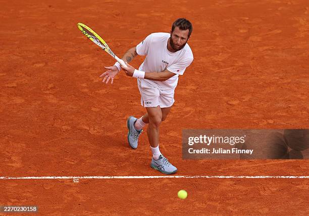 Corentin Moutet of France plays an underarm serve to Alexandre Muller of France during day three of the Rolex Monte-Carlo Masters at Monte-Carlo...